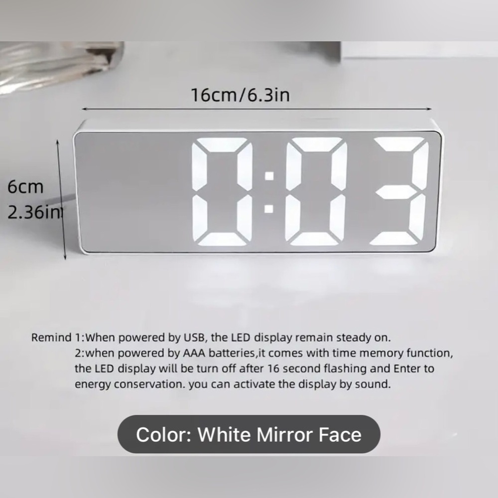 NIB thin mirrored/white digital clock/alarm with date/temp/dim features.